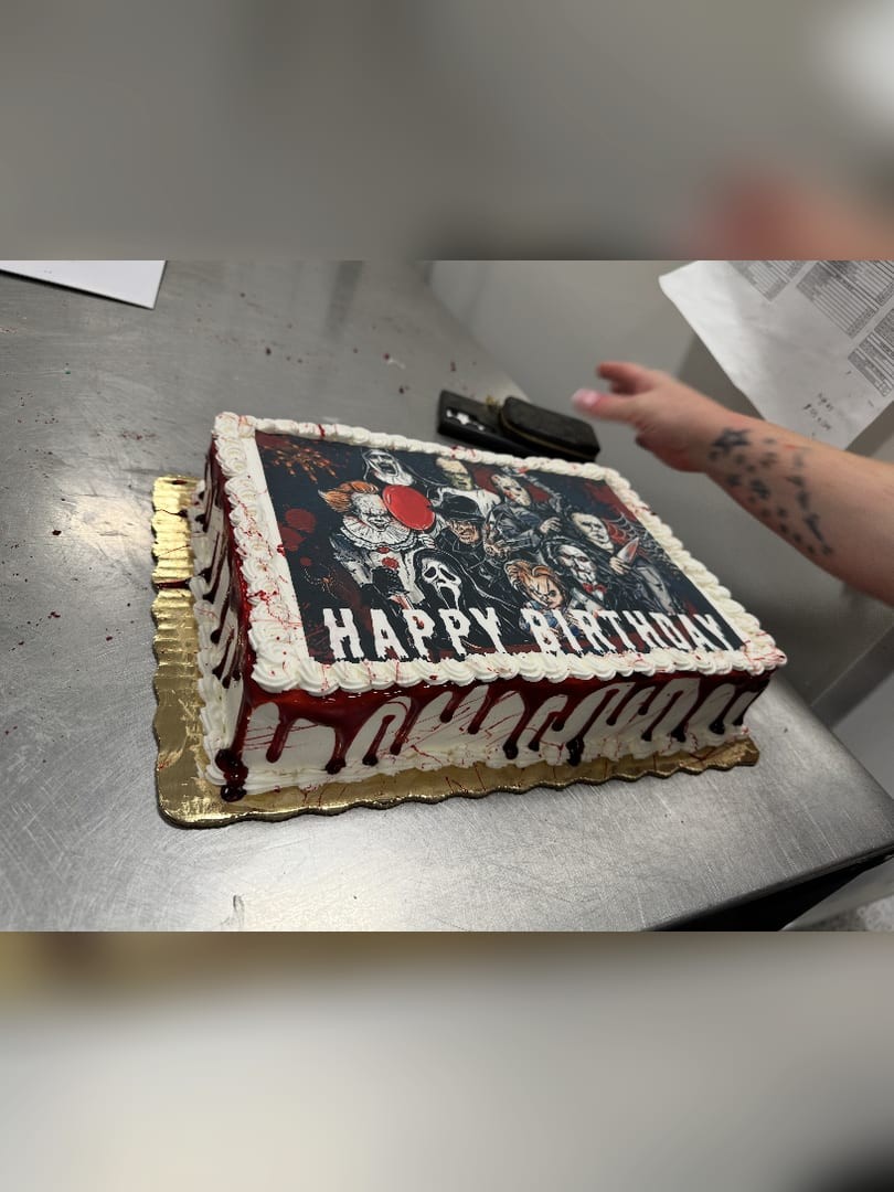 Sheet cake with a printed birthday image and a red drip border