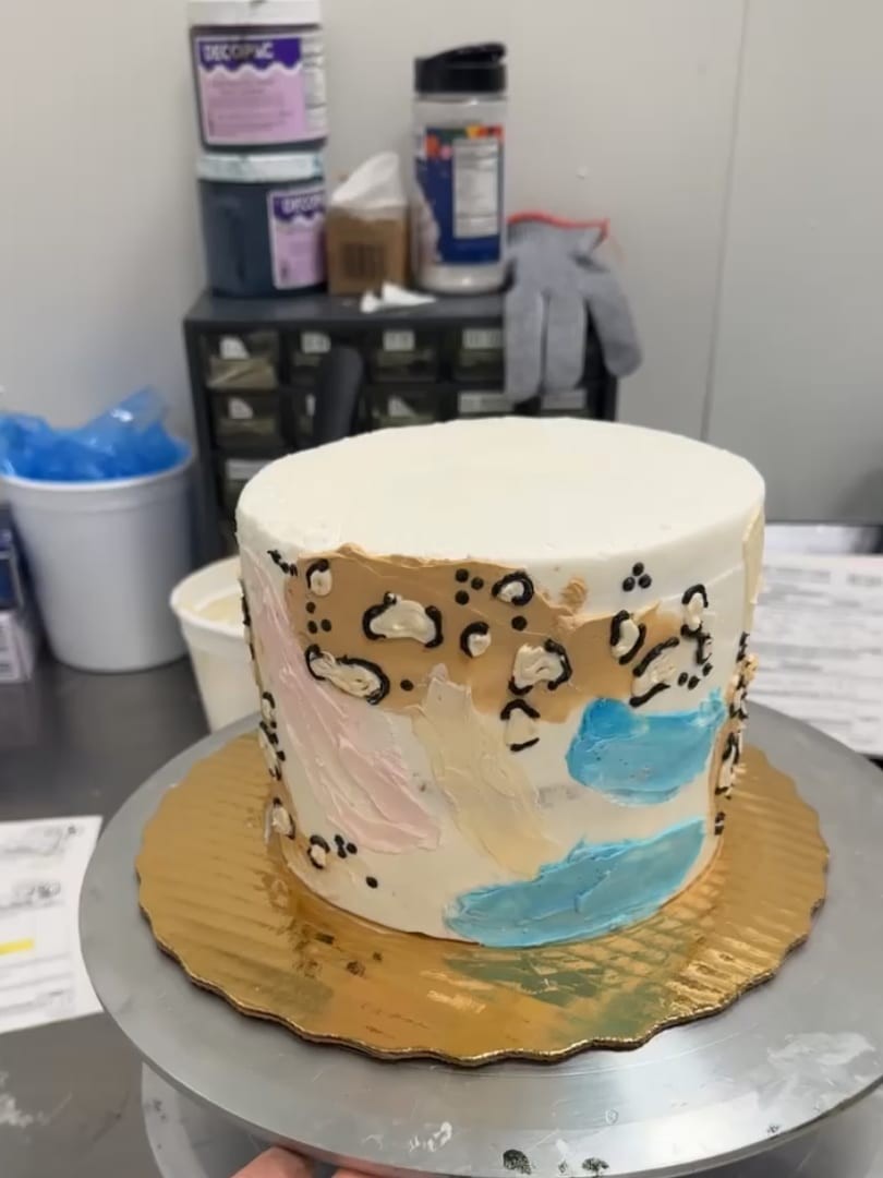 White cake with leopard print and abstract painted patches